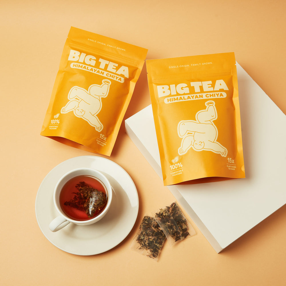 Himalayan Chiya brewed cup with tea bags, golden amber infusion
